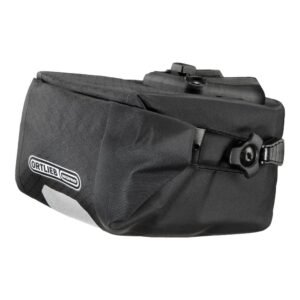 an Ortlieb Micro Two saddle pack is shown in a black waterproof fabric with a roll-down closure that clips to the sides of the pack