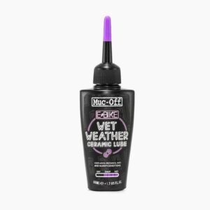 A small black bottle of Muc-Off eBike Wet Lube is shown with a purple lid