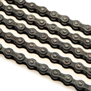 A series of Izumi Chain 410's are shown lined p on a white surface, showing their black links