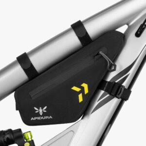 An Apidura Backcountry Frame Pack (1L) is shown mounted inside the frame of a mountain bike