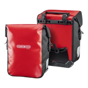 A pair of Ortlieb Sport-Roller City panniers are shown in a red & black waterproof material