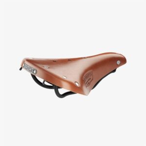 A Brooks B17 Short leather saddle is shown in honey colour with silver rivets & black saddle rails