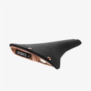 A Brooks Cambium C17 Special Edition saddle is shown with a black rubber top & copper railings & surround of the branded backplate