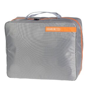 An Ortlieb Packing Cube is shown in a grey ripstop material with an orange zipper & a top handle