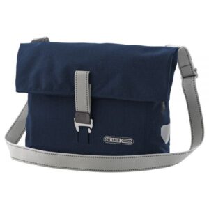 An Ortlieb Twin-City Urban shoulder bag that doubles as a pannier is shown in navy blue waterproof material