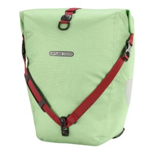 An Ortlieb Back-Roller Design PS33 pannier bag is shown in a pistaccio green waterproof material with cherry red straps