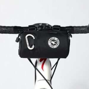 A ULAC Coursier Sprint Handlebar Bag 1.5L is shown mounted to a drop-bar bike's handlebars via Velcro straps. The bag is shown in a durable black material with a carabiner on the front