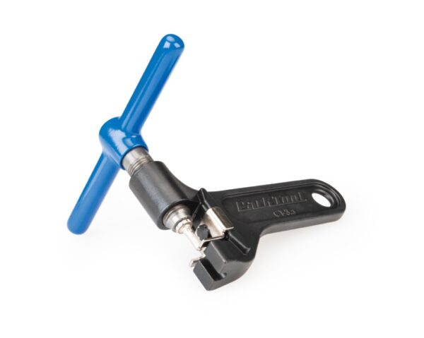 A blue handled Park Tool Chain Tool is shown with a black cast steel body & replaceable driving pin visible.